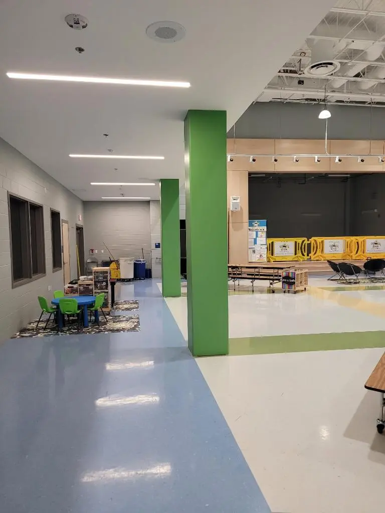 Frederick school cafeteria columns painted green